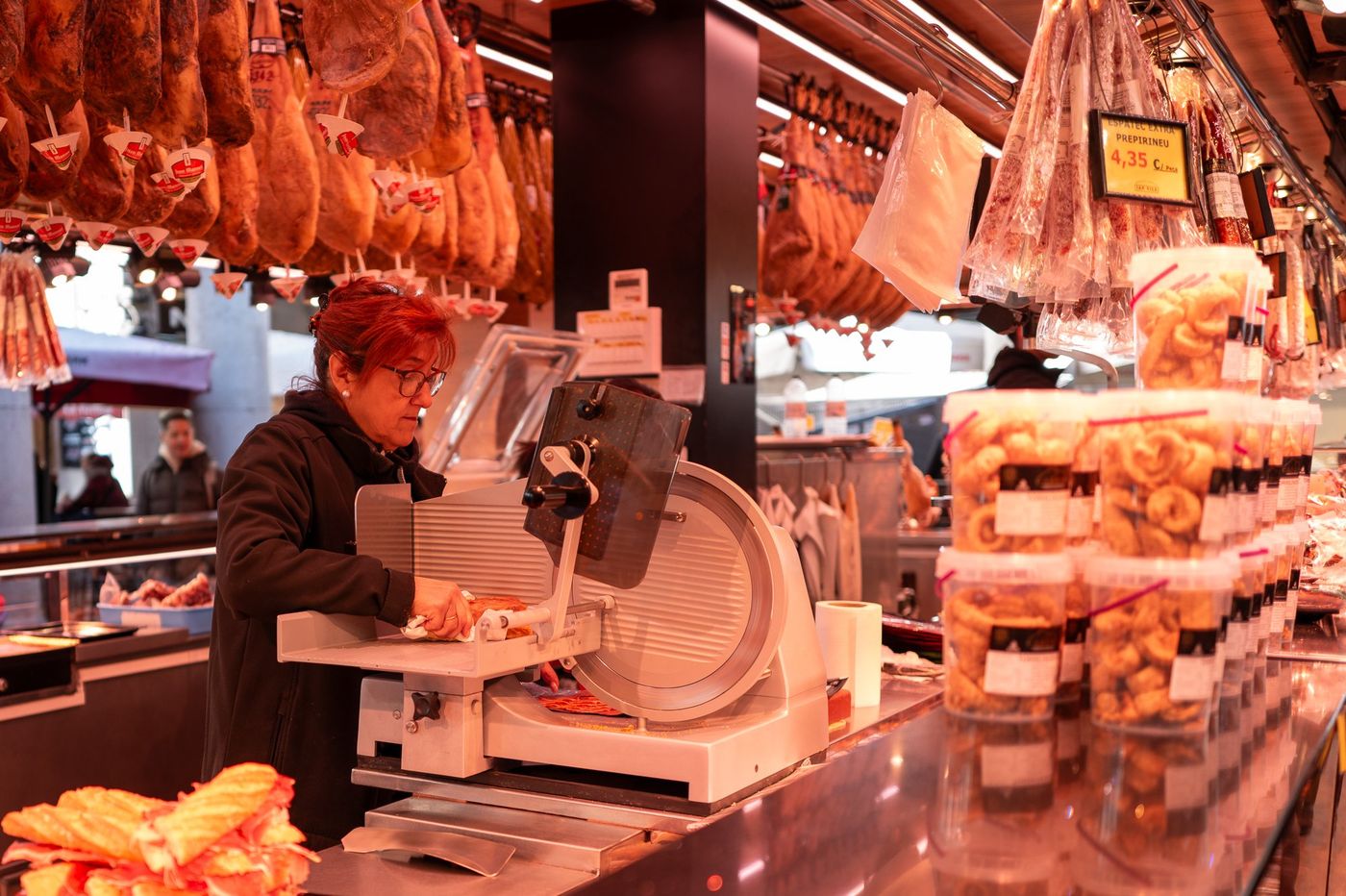 Stall of hanging hams at La Boqueria market, Barcelona