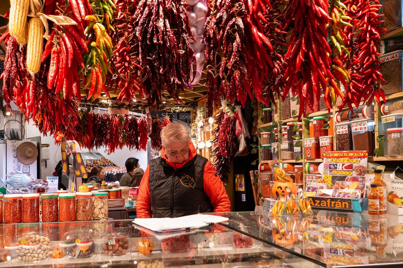 Peppers and spices hanging at a market stall, Barcelona