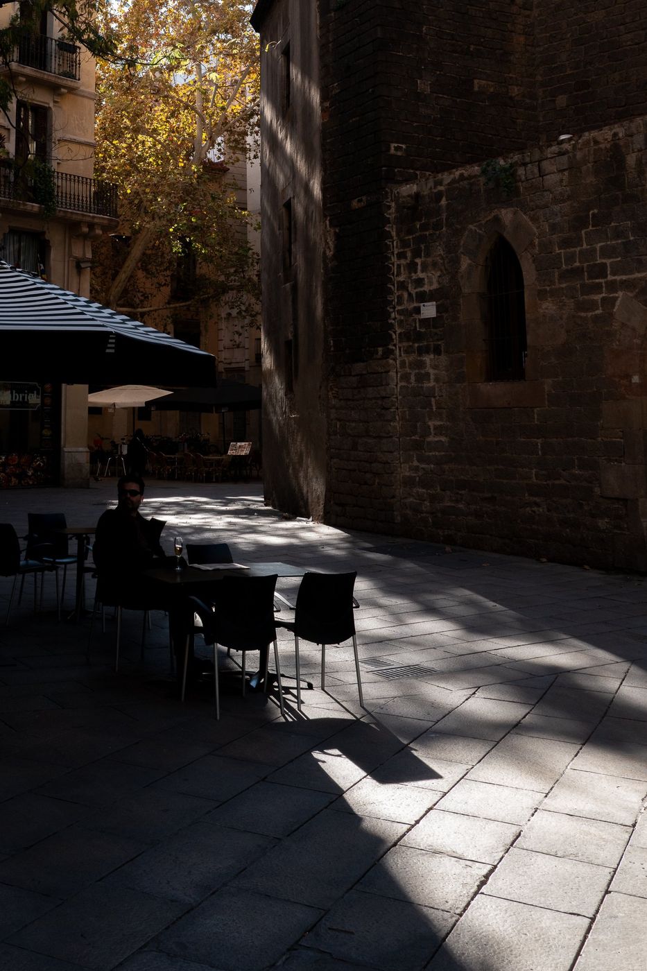 Caf&eacute; terrace in the shade of a building, Barcelona