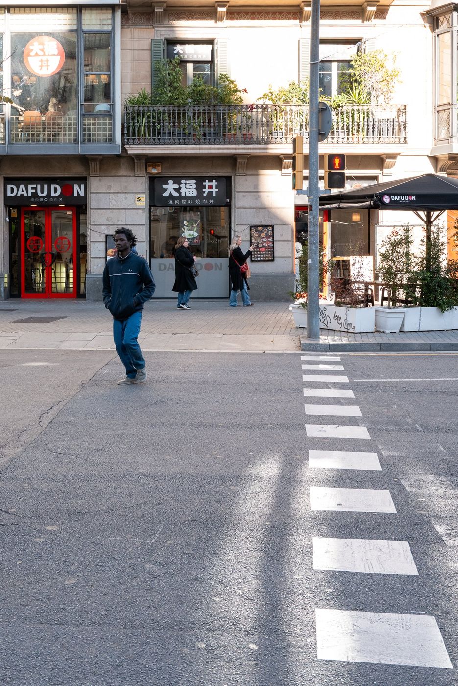 Crosswalk in front of a shop front, Barcelona