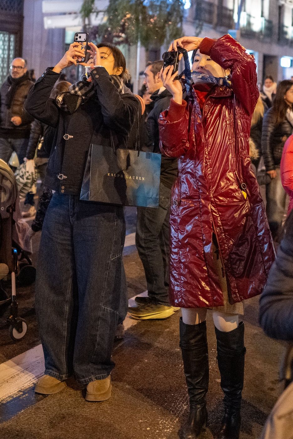 Costumed street performer being photographed by tourists, Barcelona