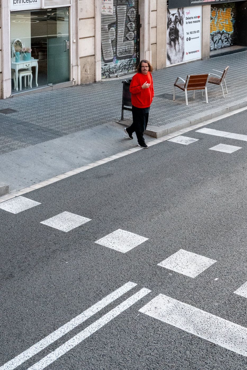 Woman crossing a crosswalk, Barcelona