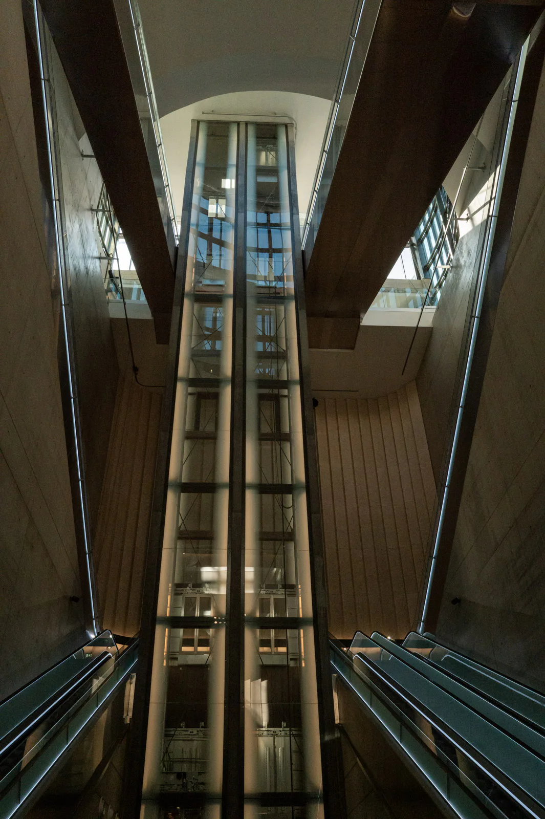 Light shafts and escalators of an underground station, seen from below, Bergen