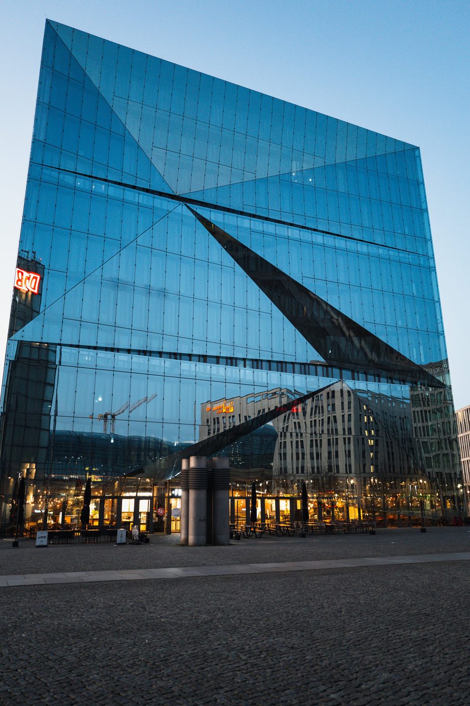 Low-angle view of the geometric glass lines of a cubic building, Berlin