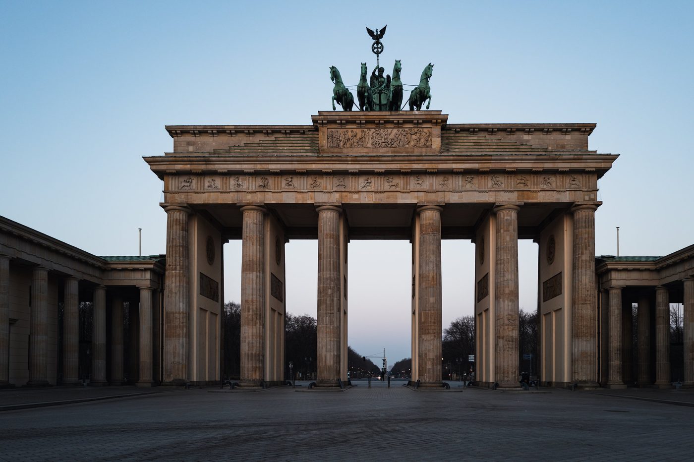 Front view of the Brandenburg Gate and its bronze quadriga in the early morning, Berlin
