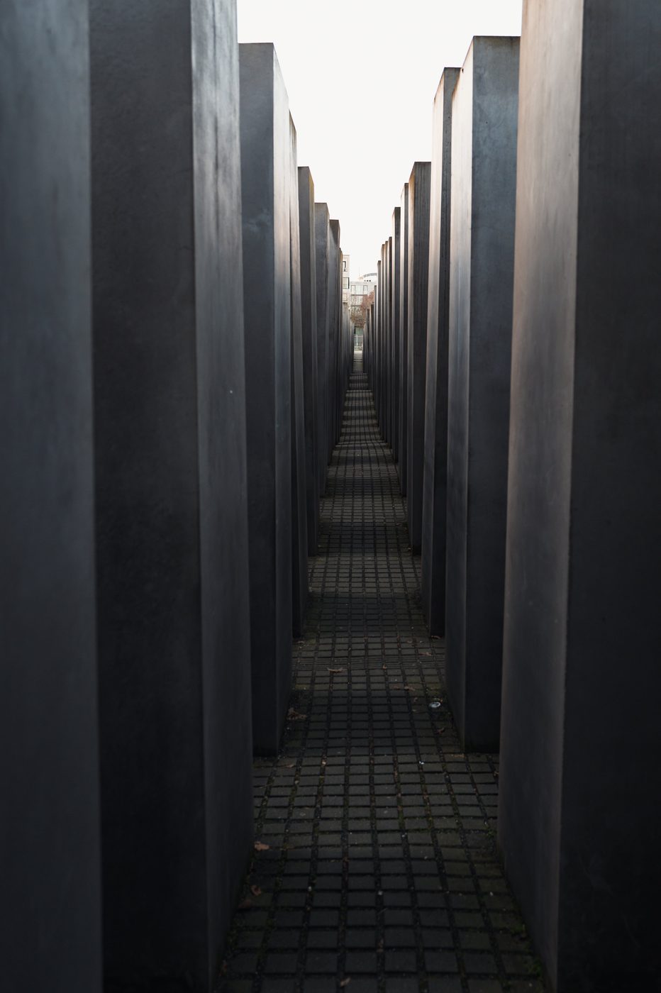 Narrow corridor between the gray slabs of the Holocaust memorial, Berlin