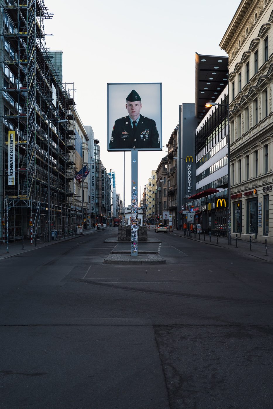 Giant portrait of a soldier looming over the former Checkpoint Charlie post, Berlin