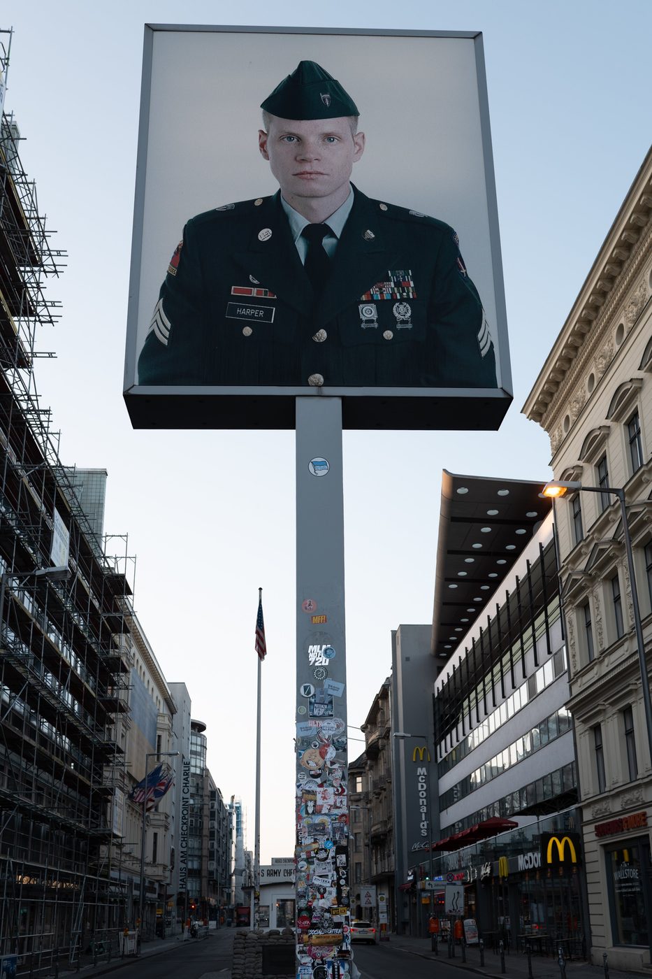 Close-up view of the soldier's portrait and the American flag, Checkpoint Charlie, Berlin