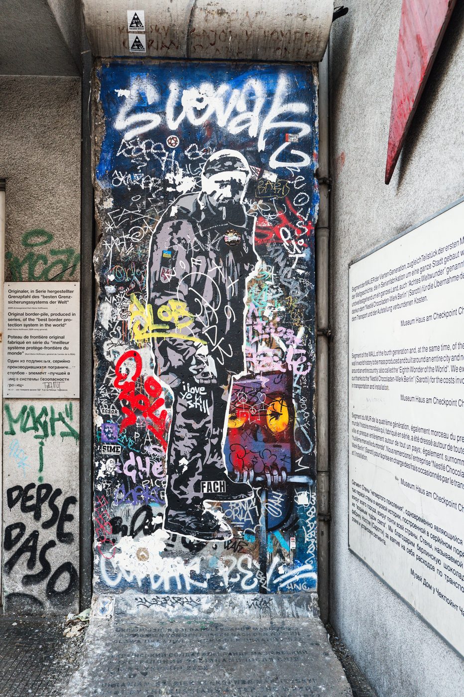 Silhouette painted on a graffiti-covered remnant of the Berlin Wall, Berlin