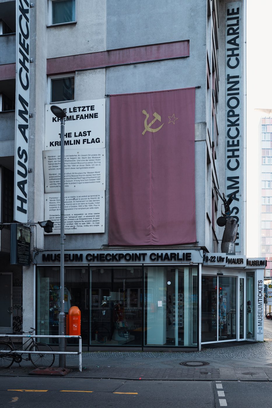 Facade of the Checkpoint Charlie museum decorated with a reconstructed Soviet flag, Berlin