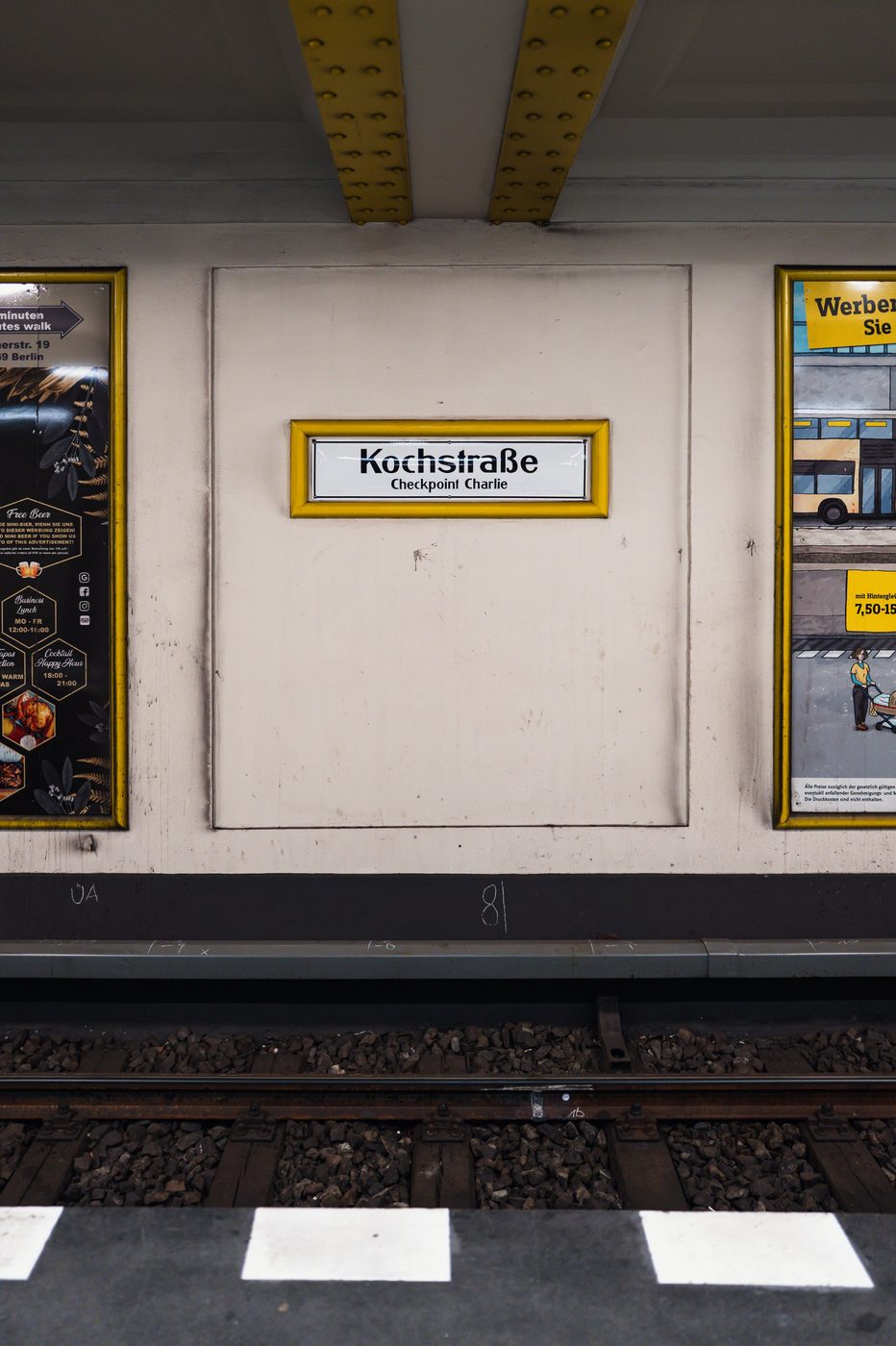 Sign at the Kochstrasse subway station pointing to Checkpoint Charlie, Berlin