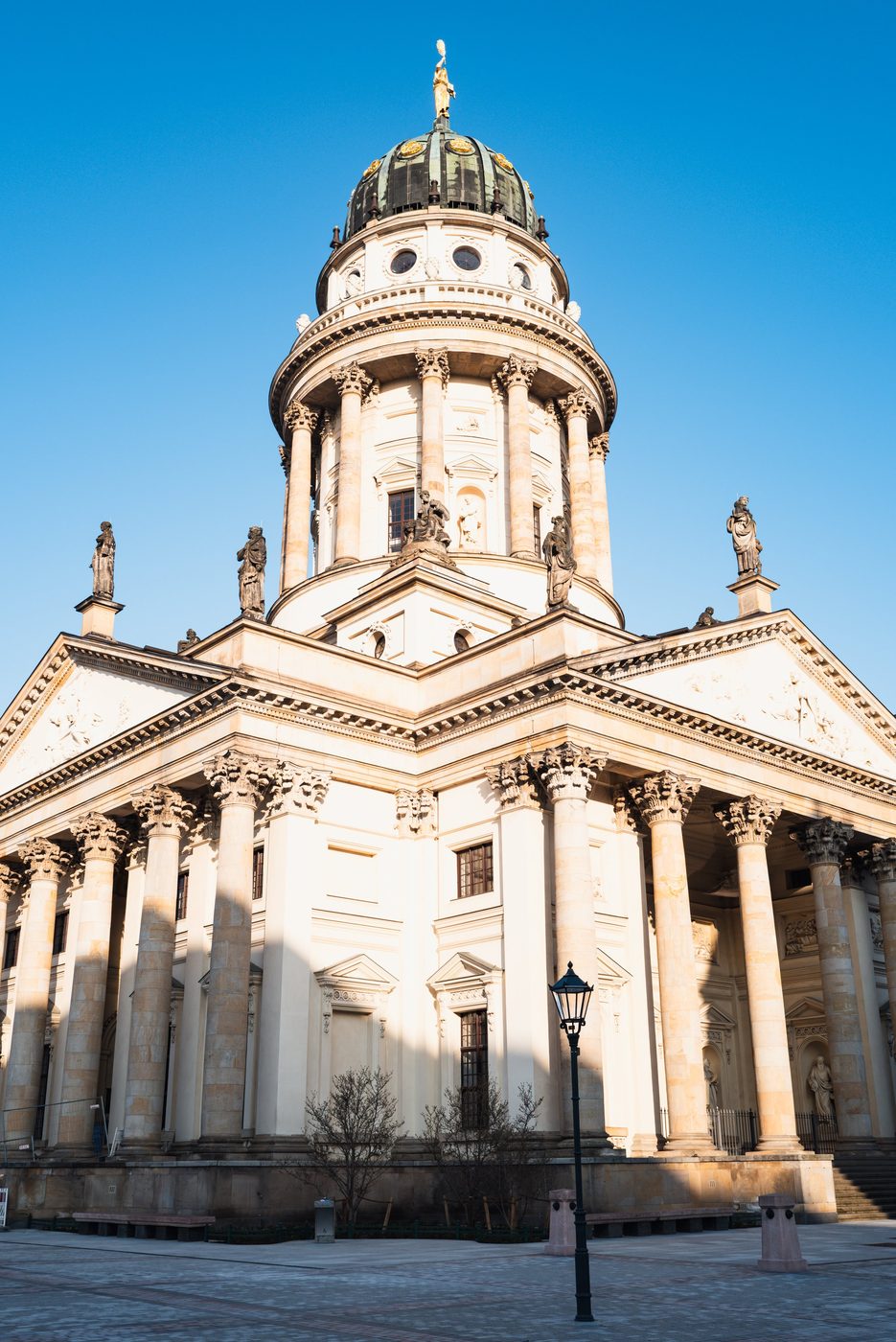 Low-angle view of the columns and golden dome of the French Cathedral, Berlin