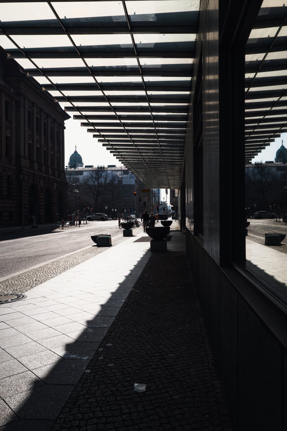 Metal glass roof in perspective above a pedestrian walkway, Berlin