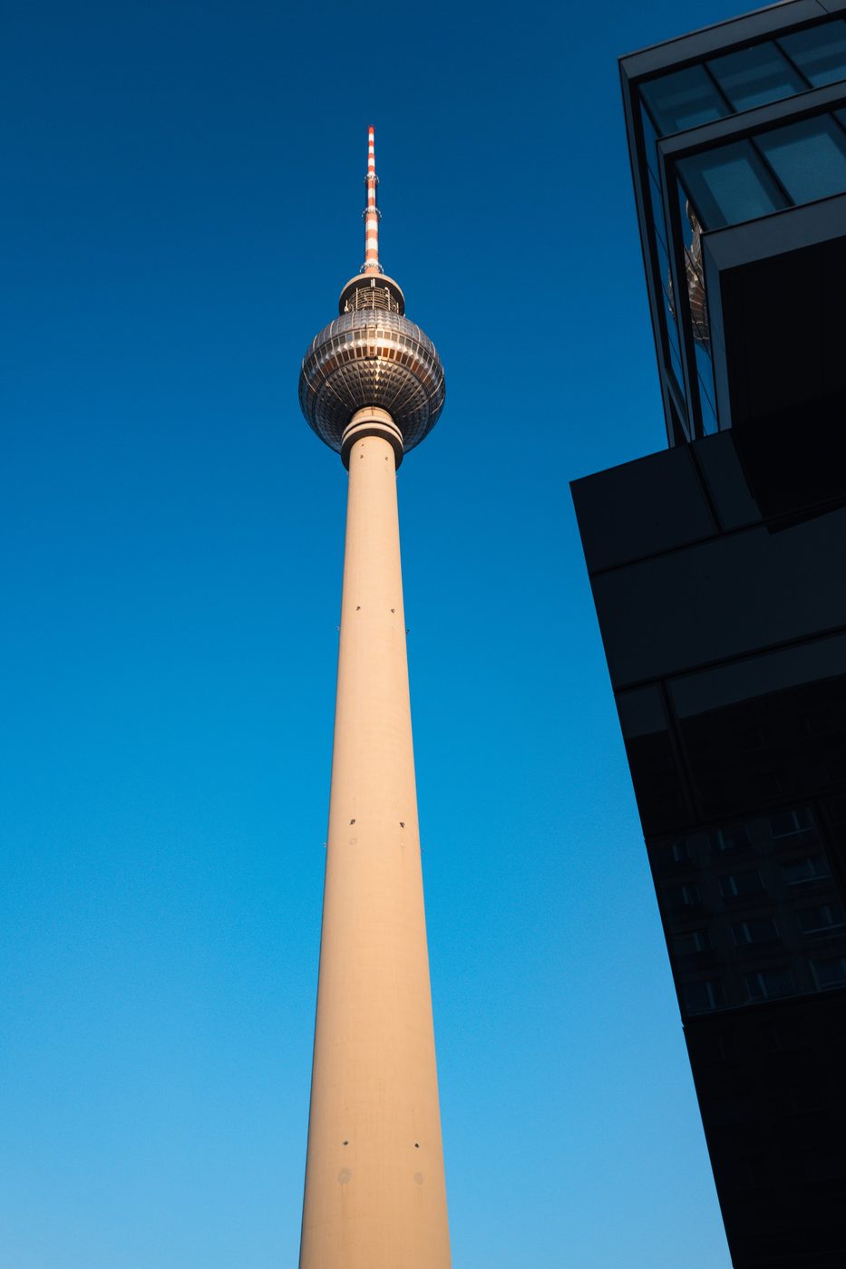 Slender television tower standing out against a deep blue sky, Berlin