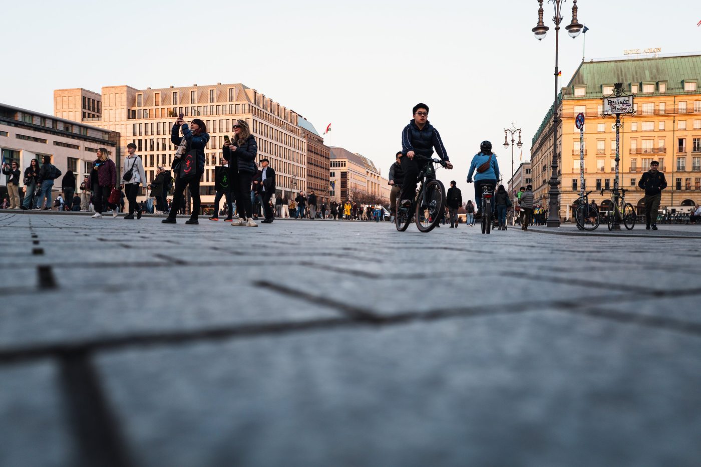Cyclist crossing the Pariser Platz in front of the Hotel Adlon, Berlin