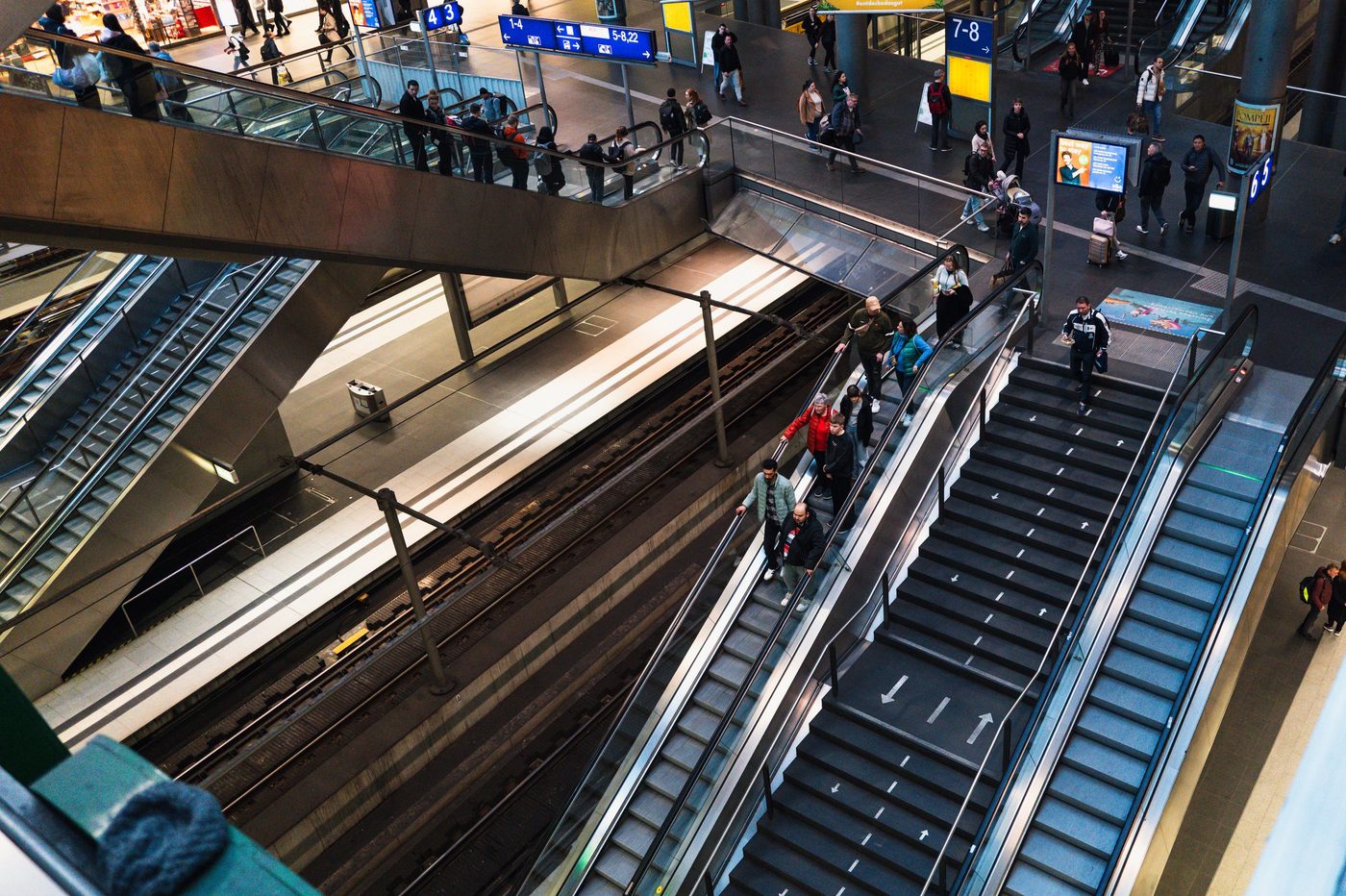 Stacked escalators at the central station, travelers in motion, Berlin