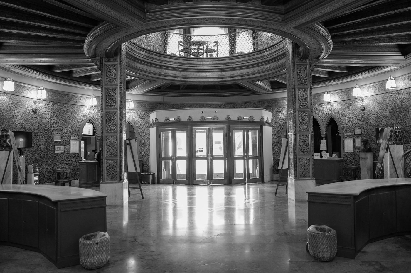 Oval entrance hall of a historic building, glass doors in the background, Budapest