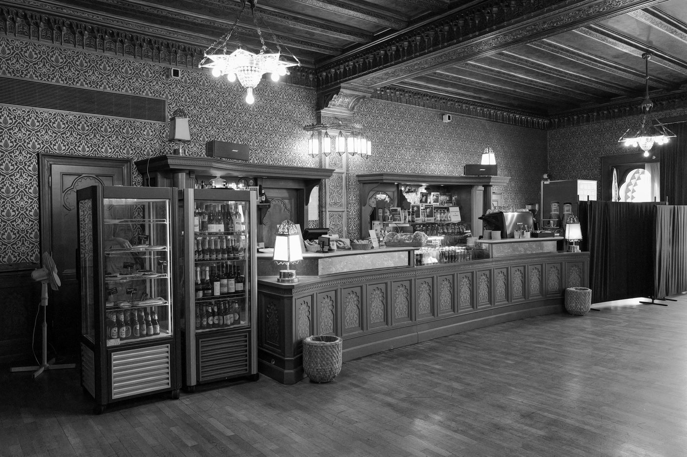 Ornate bar counter in a room with patterned walls, Budapest