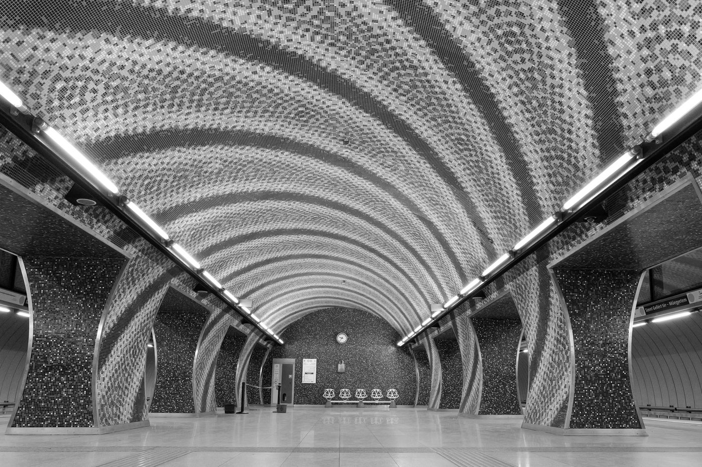 Arched mosaic ceiling above an empty metro platform, Budapest