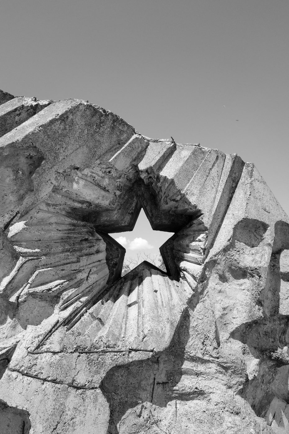 Openwork star cut into a fragment of a concrete statue, Budapest