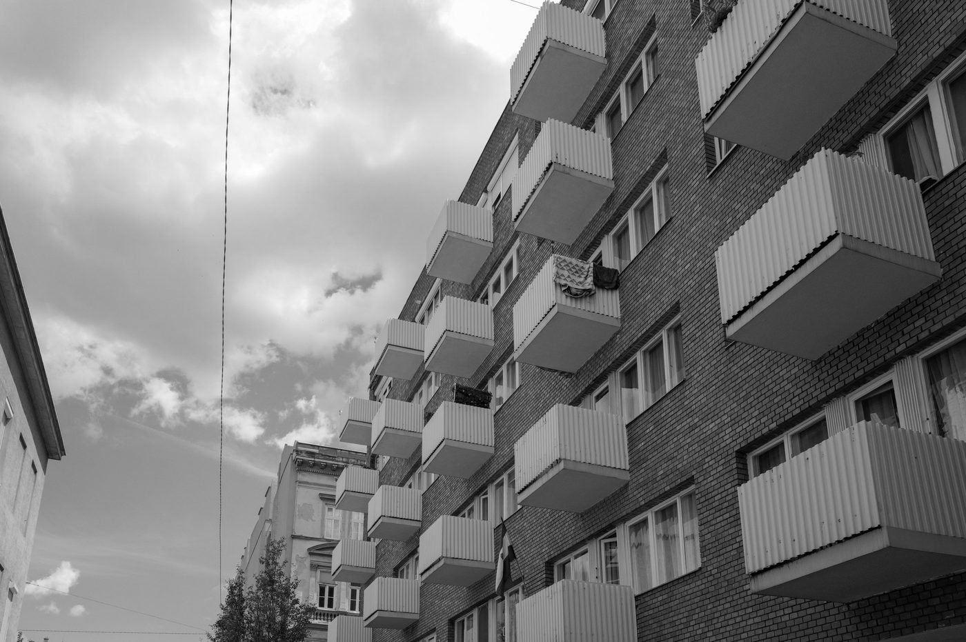 Building facade with a row of prefabricated balconies, residential district, Budapest