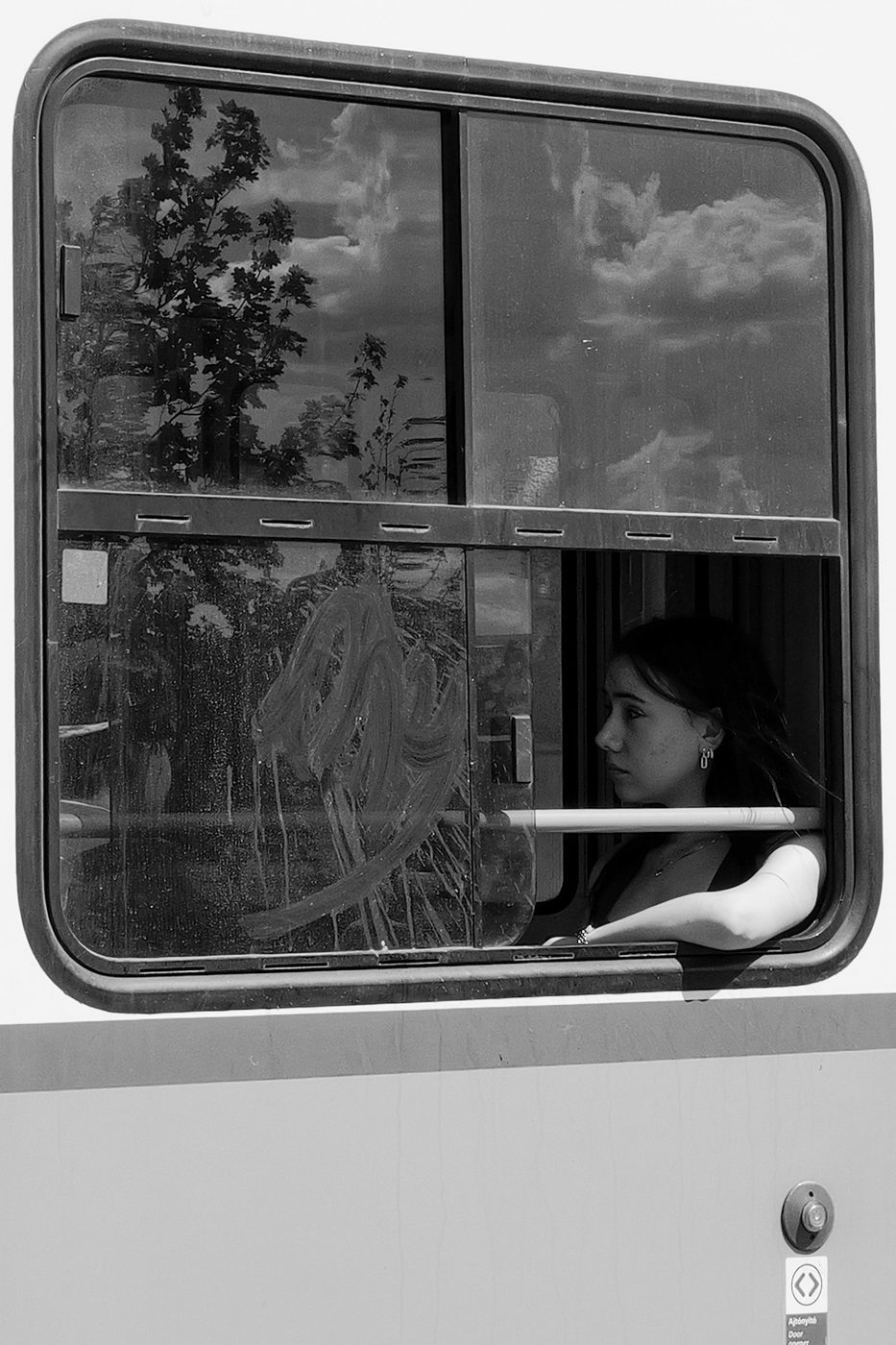 Portrait of a passenger through the fogged-up window of a tram, Budapest