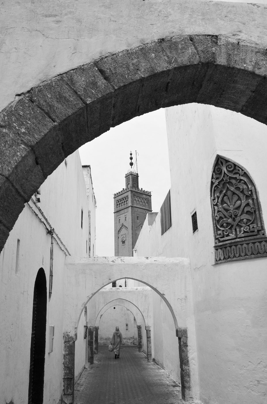 Vaulted silhouette framing the minaret at the end of an alley, Casablanca