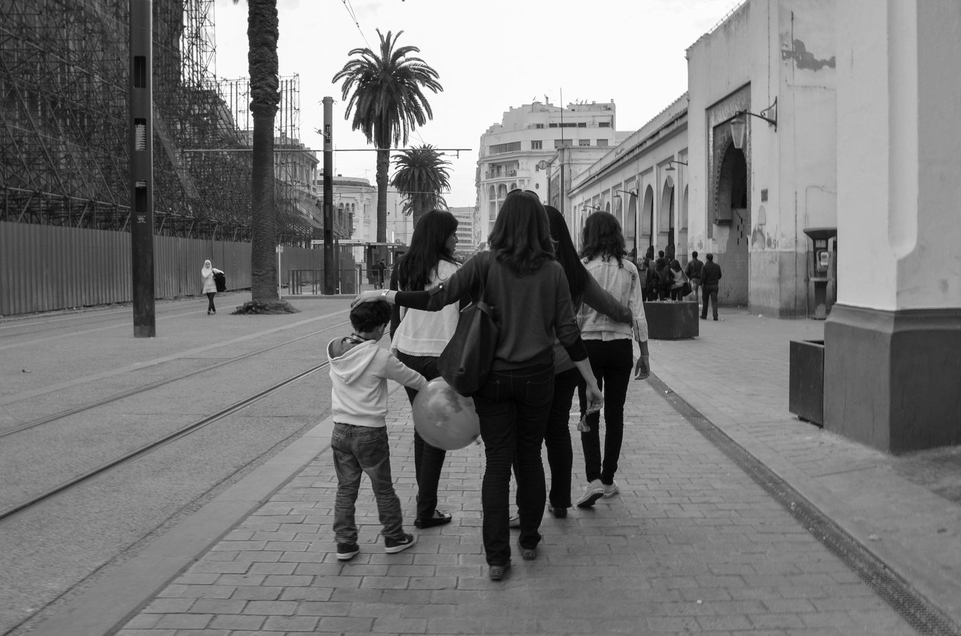Group of women walking arm in arm on a sidewalk, Casablanca