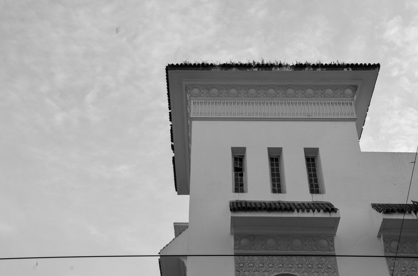 Moorish frieze cornice on a white building, Casablanca