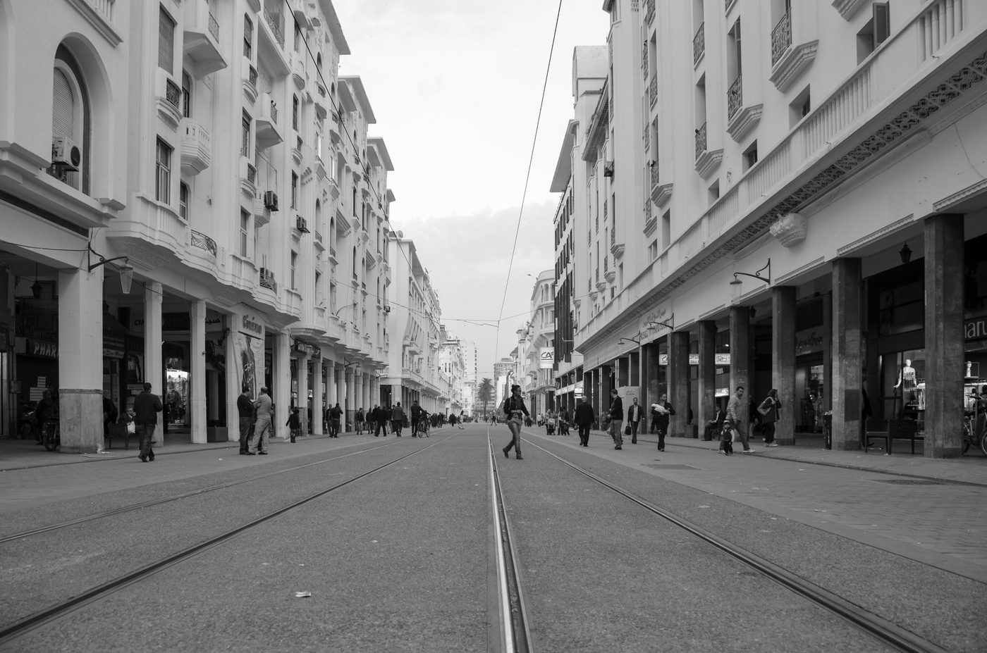 Street perspective toward the horizon between two white facades, Casablanca
