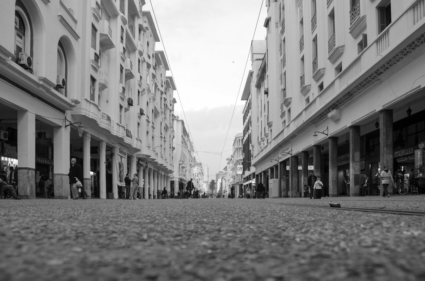 Ground-level view of tracks running between the buildings, Casablanca
