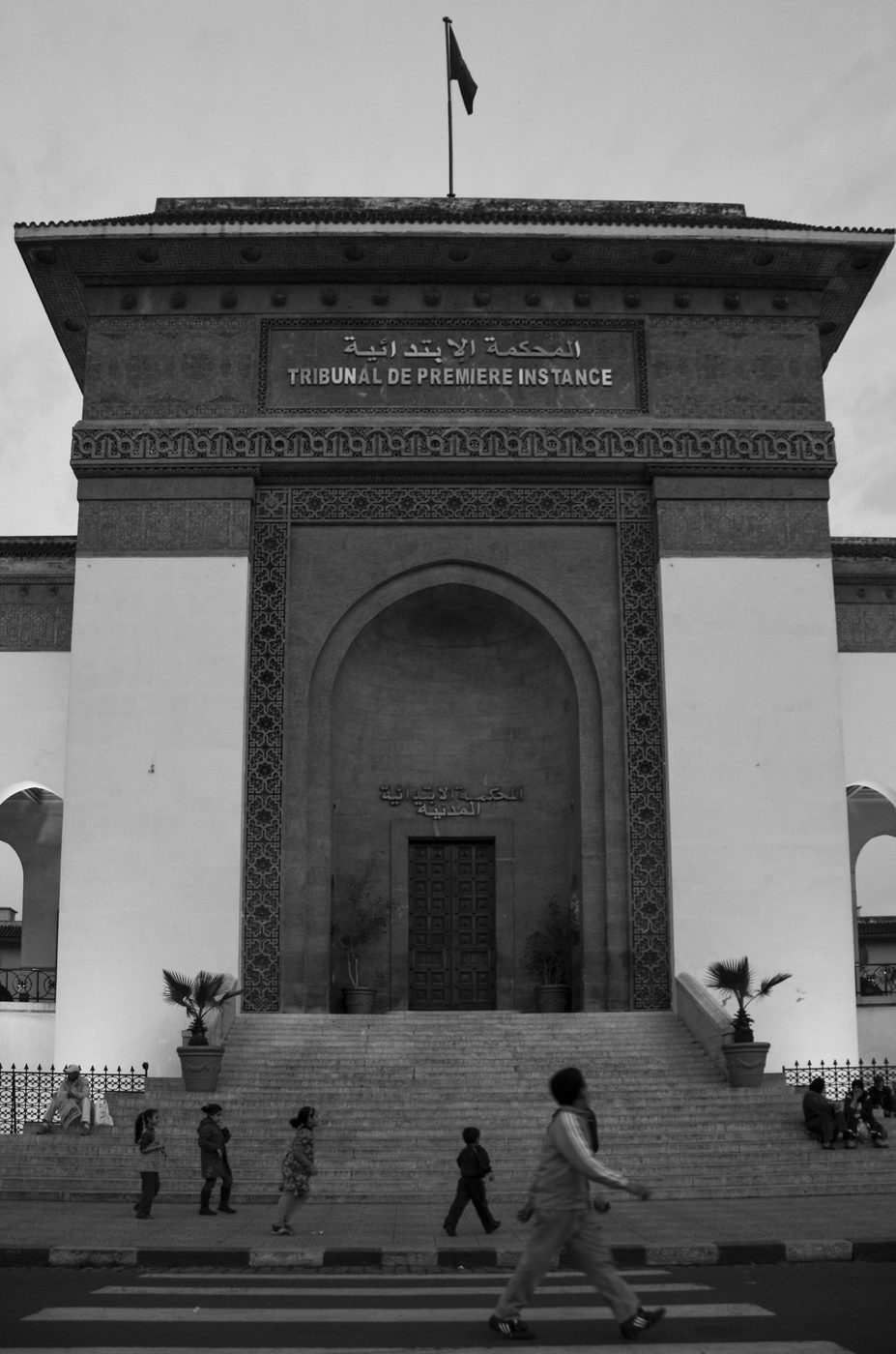 Children crossing in front of the courthouse's monumental entrance, Casablanca