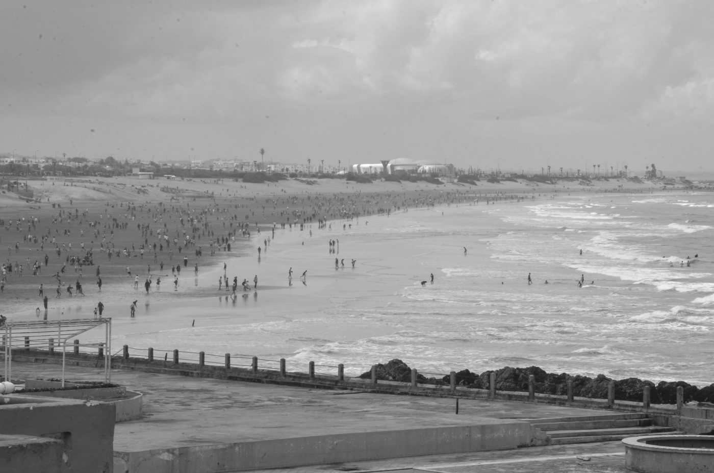 Scattered crowd on the beach facing the Atlantic waves, Casablanca