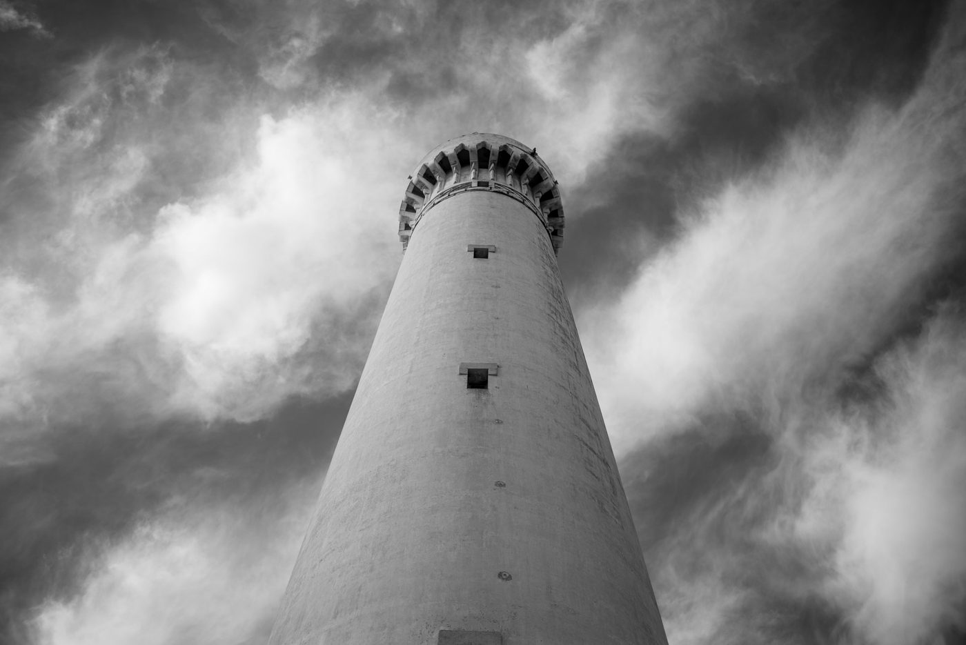 Lighthouse rising toward a sky heavy with clouds, Casablanca