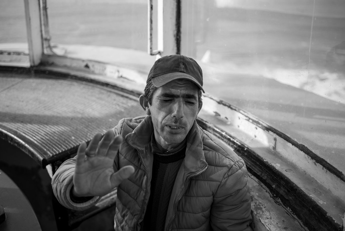 Lighthouse keeper raising his hand in the glazed gallery, Casablanca
