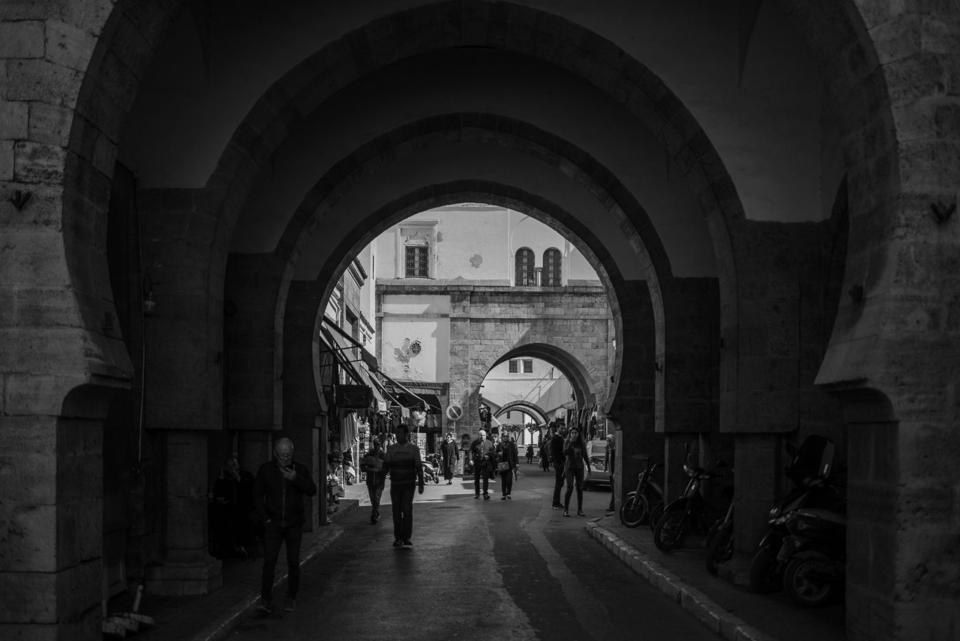 Double stone arch leading toward the bustling medina, Casablanca