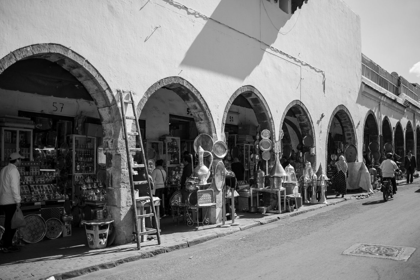Copperware stalls arranged beneath the souk's arcades, Casablanca