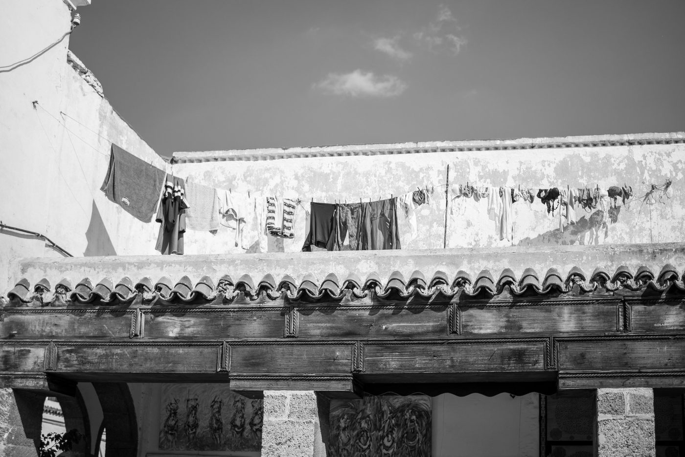 Laundry hanging against a white wall under a blue sky, Casablanca
