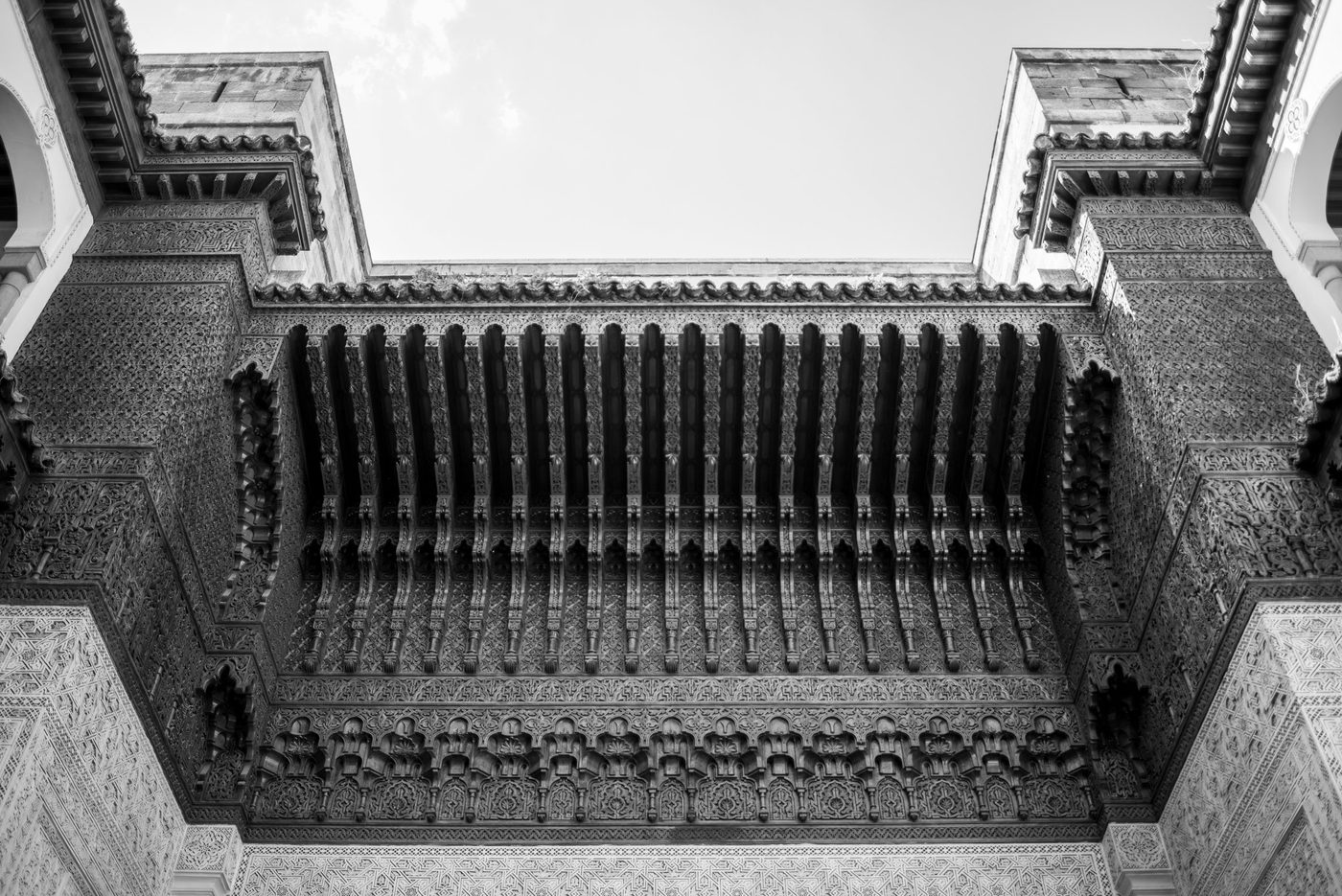 Finely carved wooden balcony seen from below, Casablanca