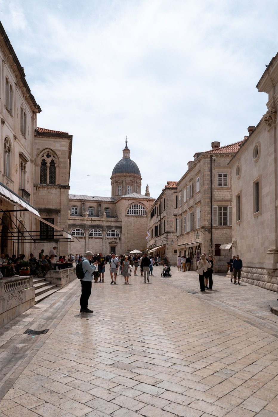 Cobbled street lined with old facades leading toward the cathedral, Dubrovnik
