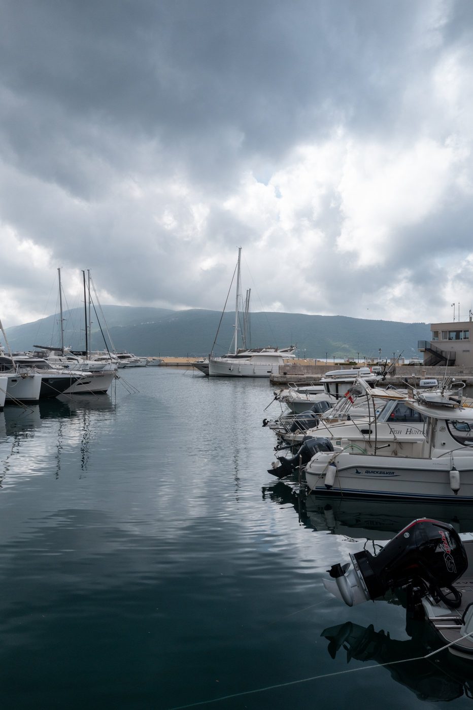 Sailboats moored in the harbor under a cloud-laden sky, Dubrovnik