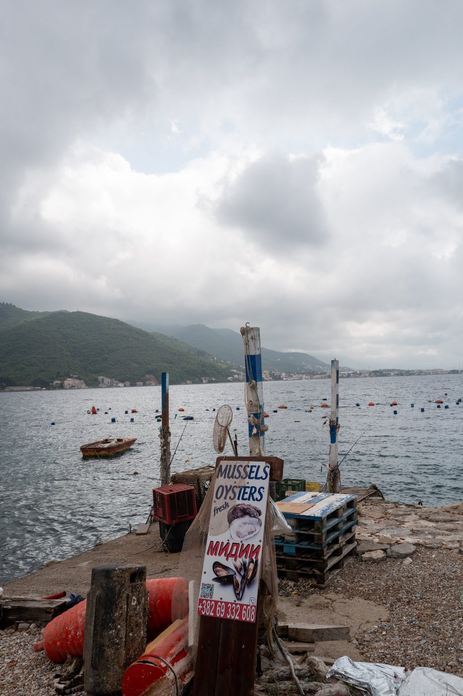 Handmade sign advertising fresh mussels and oysters on a quay, Dubrovnik