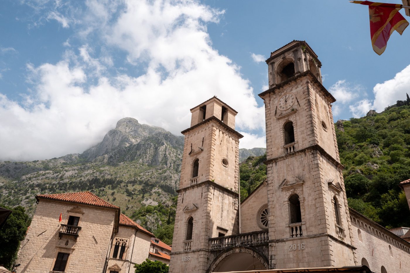 Two twin cathedral bell towers standing before the mountains, Dubrovnik