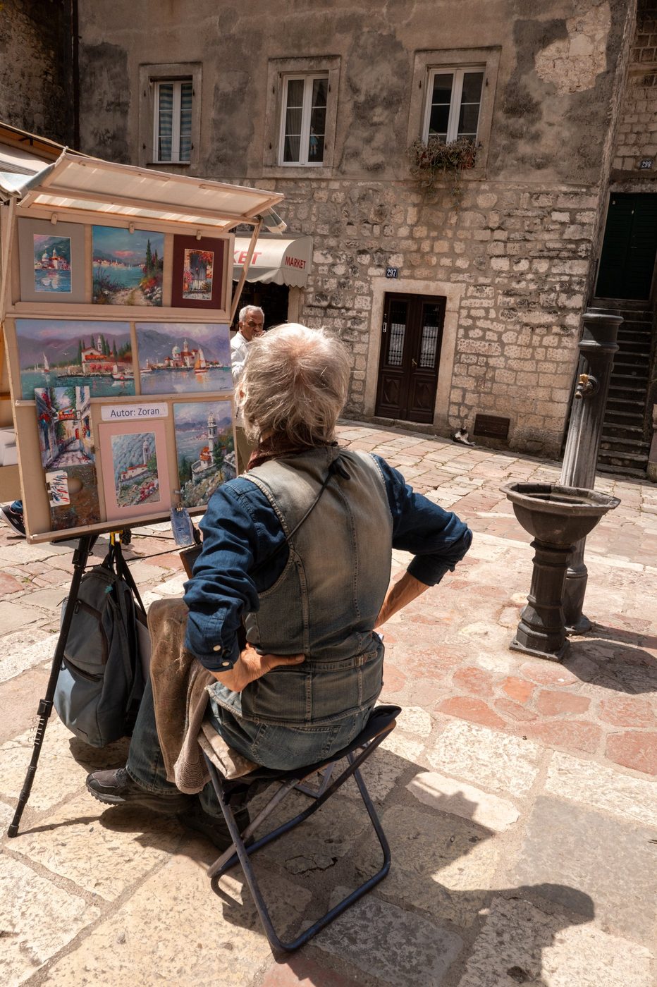 Street painter displaying his canvases on an easel, Dubrovnik