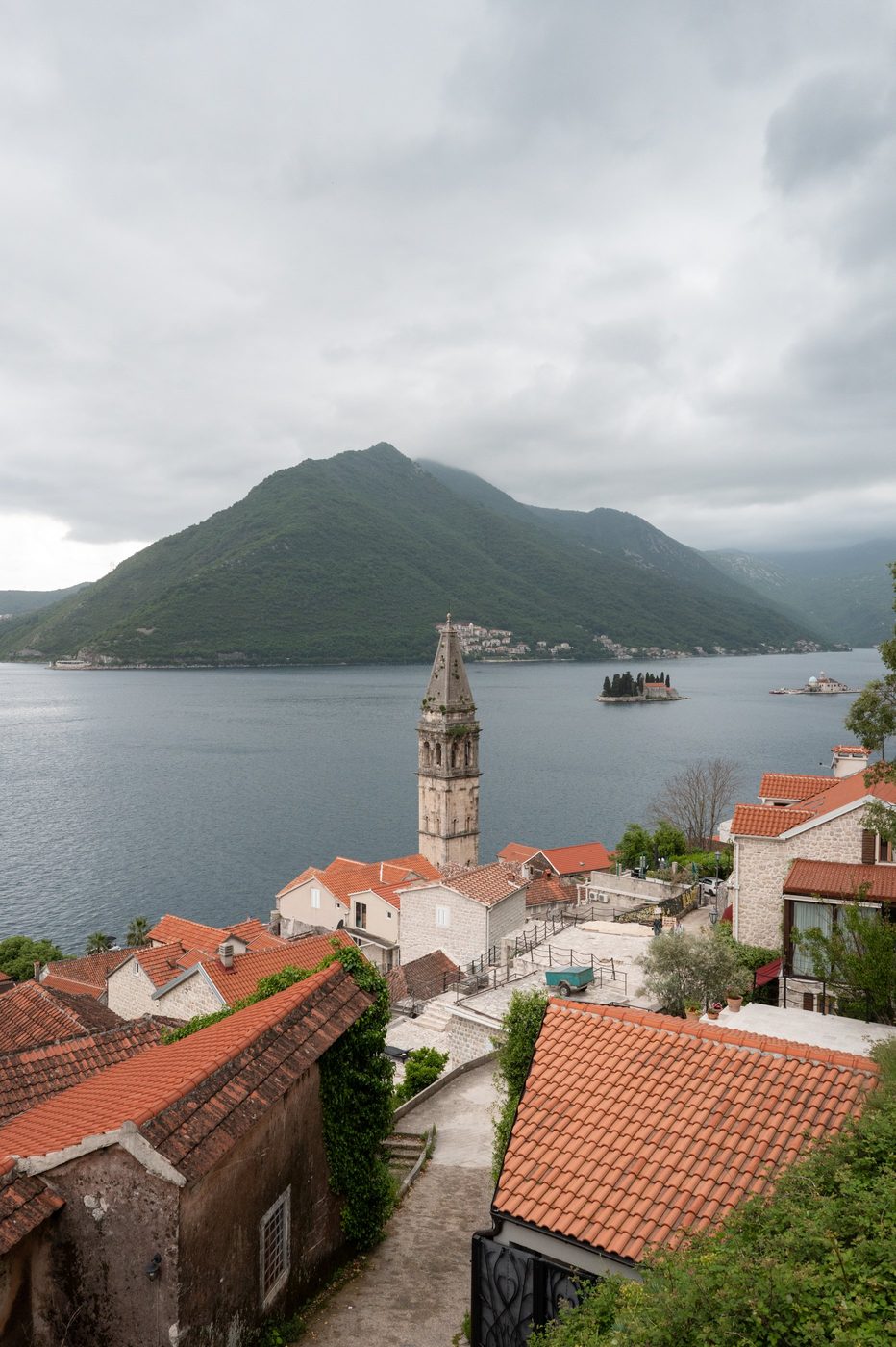 Slender bell tower overlooking a coastal village and two islets in the bay, Dubrovnik
