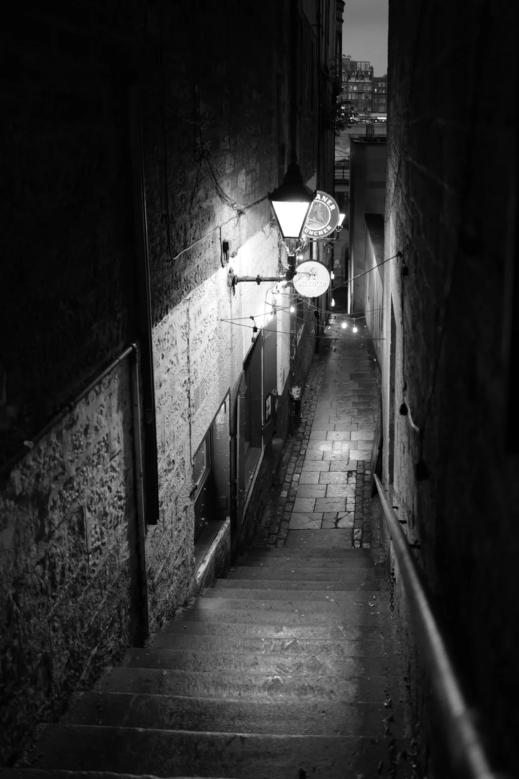 Stepped close lit by a lantern at night, Edinburgh