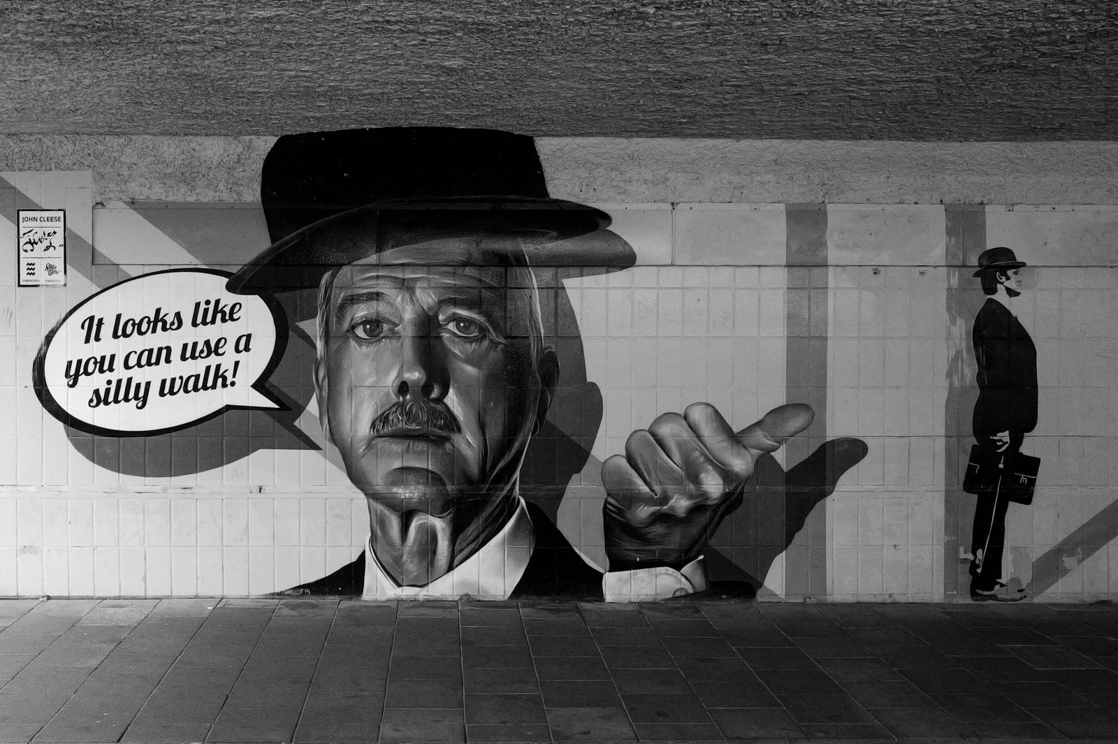 Fresque d'un homme en chapeau melon, bulle 