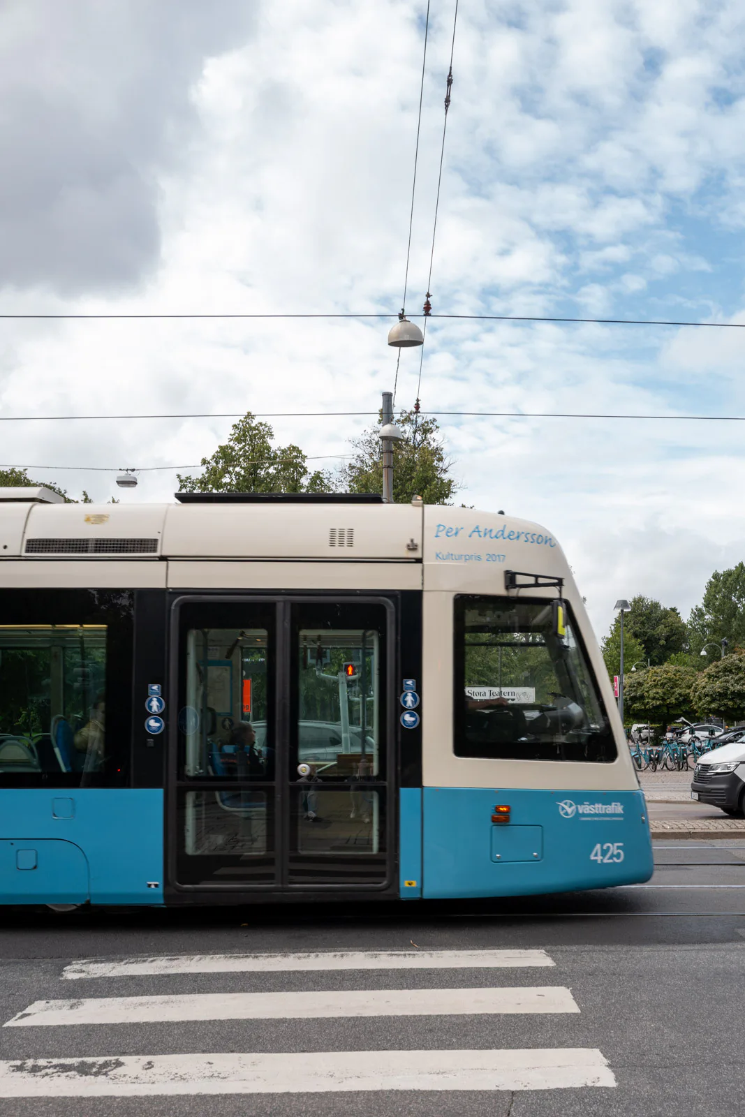 A blue tram passing a pedestrian crossing, Gothenburg