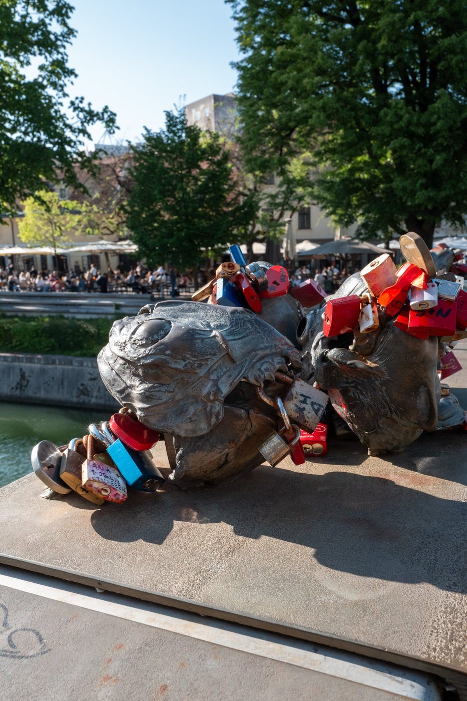 Padlocks attached to the jaws of the bronze dragons, Ljubljana