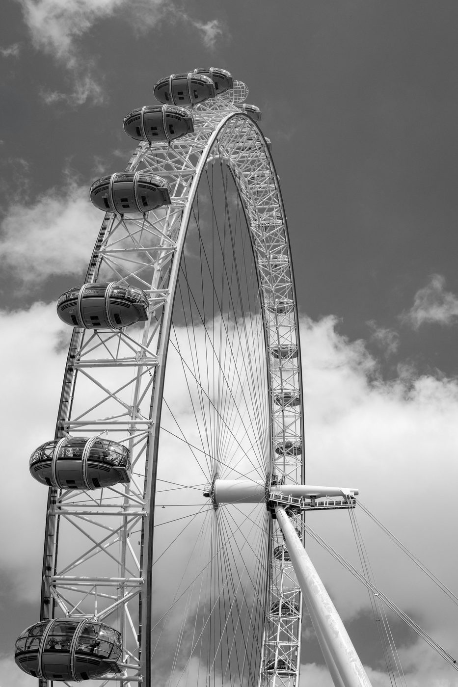 Low-angle view of the pods and metal structure of the London Eye, London